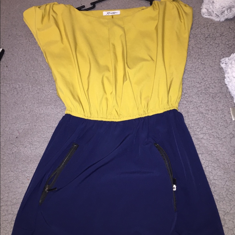 It’s a mustard yellow and dark blue dress